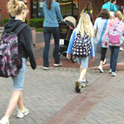 students walking downtown with backpacks