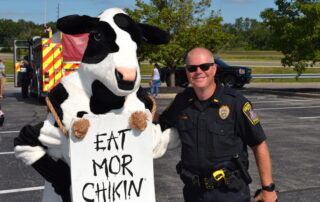 Police officer with Chick fil a cow