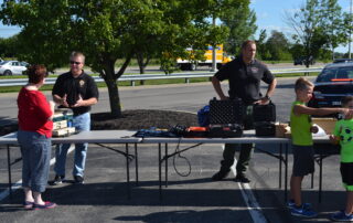 Police officers at demonstration table