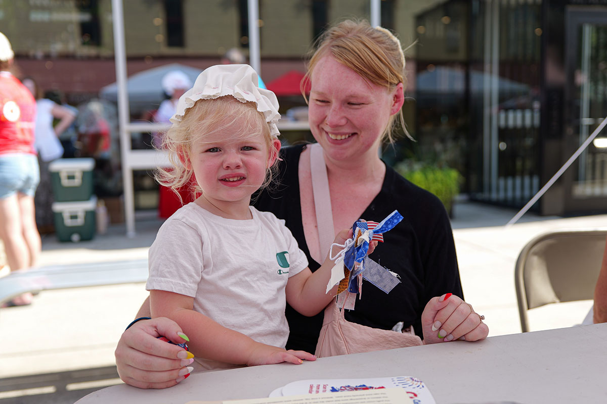 People take part in American Revolutino Day during Columbus's Celebrate 250's on Fourth Street in downtown Columbus, Indiana, Monday, June 29, 2026. Celebrate 250 is a six celebration marking America's 250th anniversary.