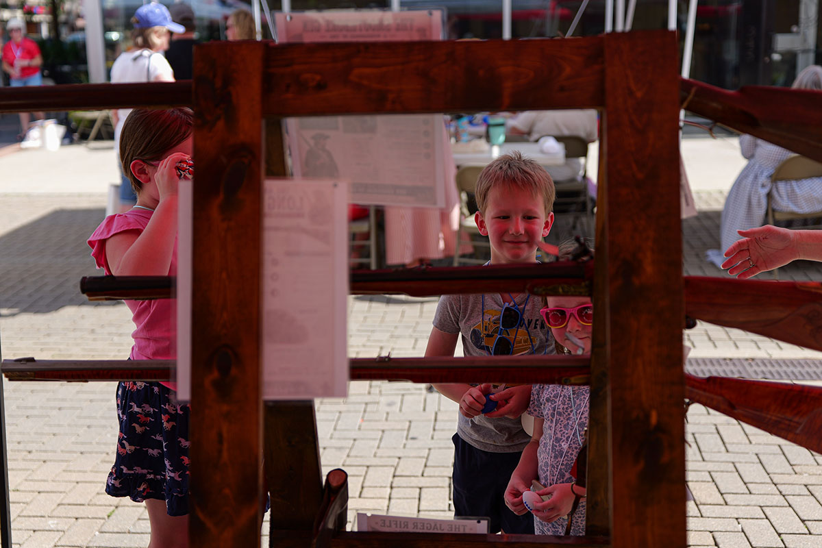 People take part in American Revolutino Day during Columbus's Celebrate 250's on Fourth Street in downtown Columbus, Indiana, Monday, June 29, 2026. Celebrate 250 is a six celebration marking America's 250th anniversary.