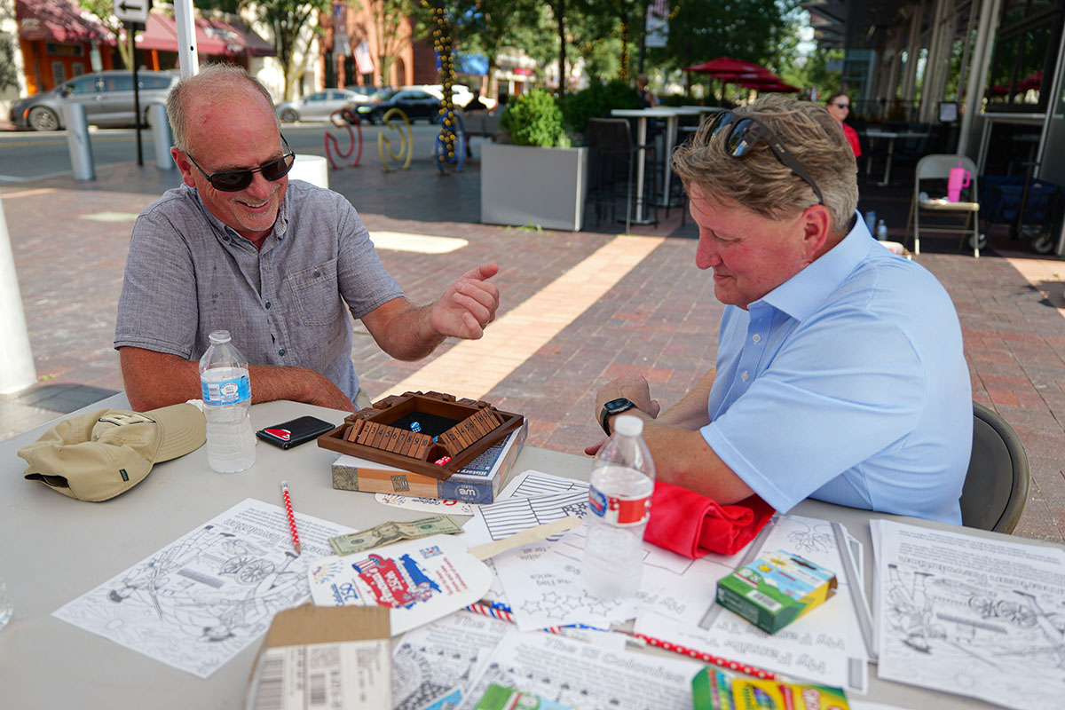 People take part in American Revolutino Day during Columbus's Celebrate 250's on Fourth Street in downtown Columbus, Indiana, Monday, June 29, 2026. Celebrate 250 is a six celebration marking America's 250th anniversary.