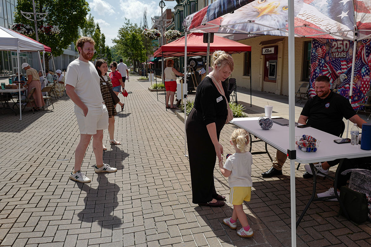 People take part in American Revolutino Day during Columbus's Celebrate 250's on Fourth Street in downtown Columbus, Indiana, Monday, June 29, 2026. Celebrate 250 is a six celebration marking America's 250th anniversary.