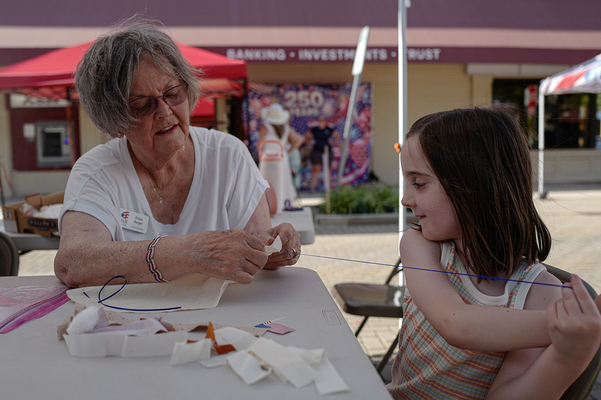 People take part in American Revolutino Day during Columbus's Celebrate 250's on Fourth Street in downtown Columbus, Indiana, Monday, June 29, 2026. Celebrate 250 is a six celebration marking America's 250th anniversary.