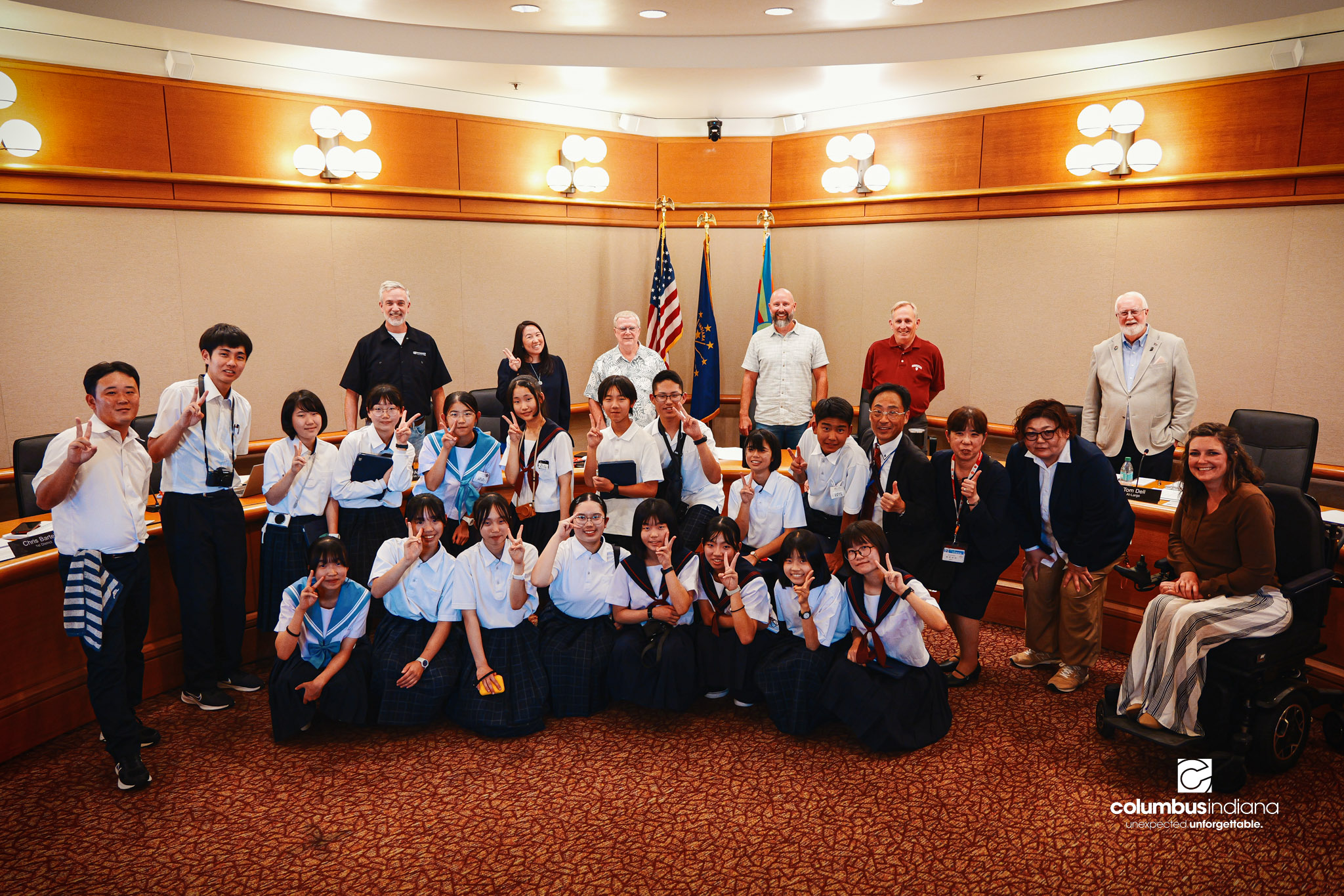 A delegation of students and school officials from Miyoshi-Minami Junior High School poses for a photo with members of Columbus City Council during a tour of Columbus City Hall in Columbus, Ind., Thursday, Aug. 20, 2026. Miyoshi is Columbus’ sister