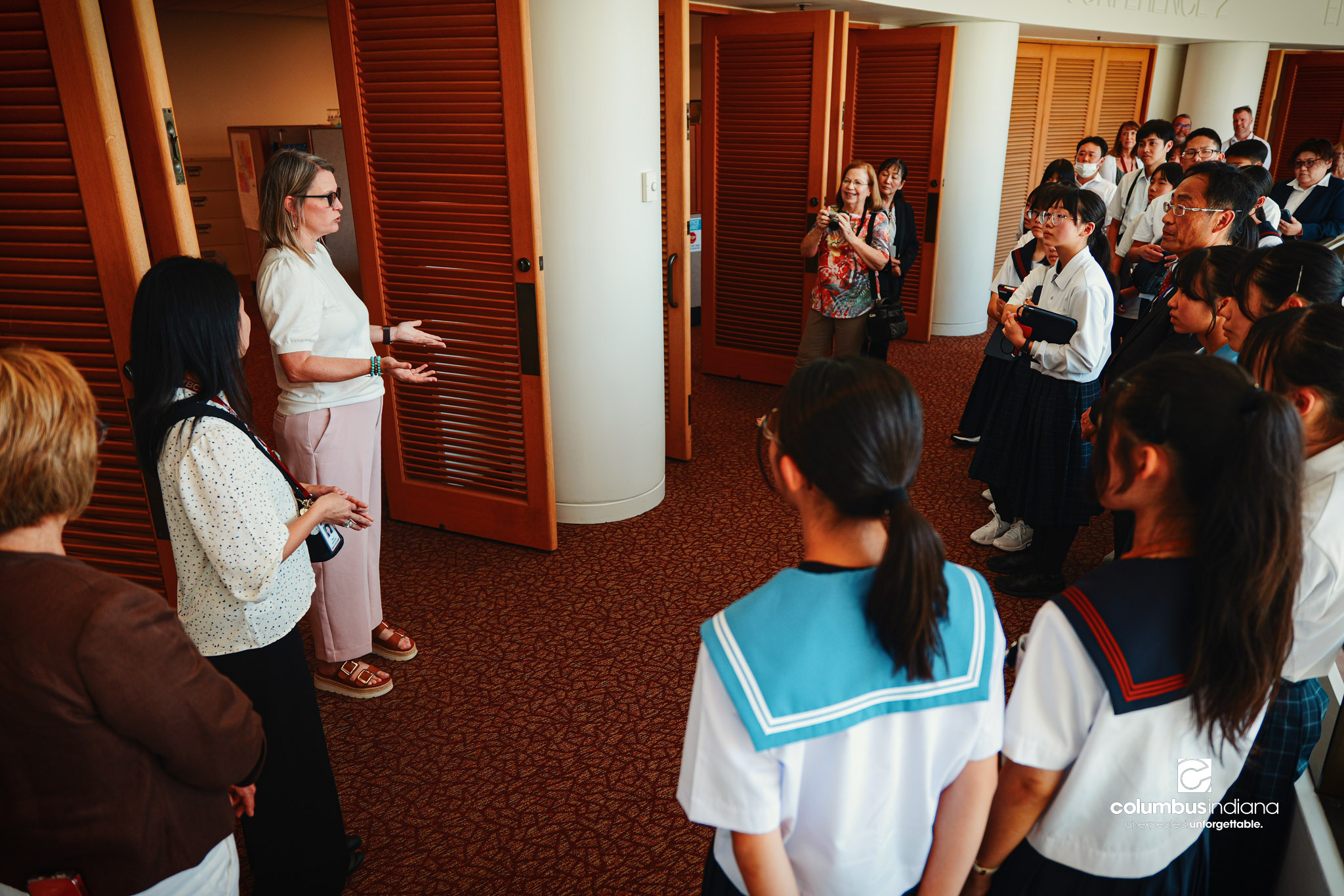 Melissa Begley, assistant director of planning for the City of Columbus, talks about the planning department to a delegation of students and school officials from Miyoshi-Minami Junior High School on a tour of Columbus City Hall in Columbus, Ind., Th