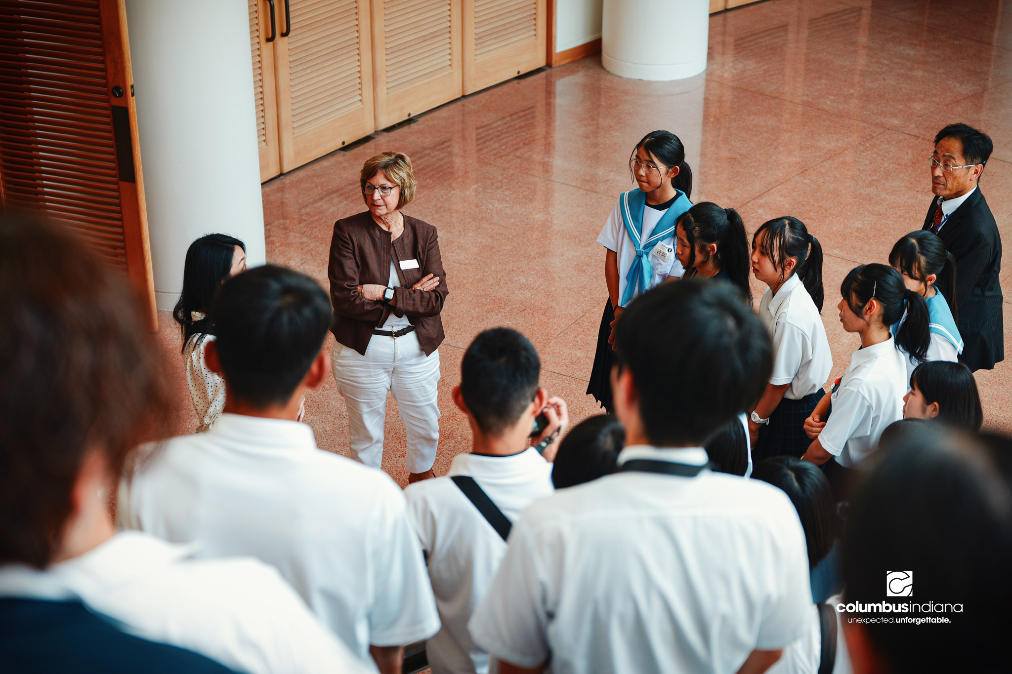 Nancy Wagner, executive assistant to the mayor, leads a delegation of students and school officials from Miyoshi-Minami Junior High School on a tour of Columbus City Hall in Columbus, Ind., Thursday, Aug. 20, 2026. Miyoshi is Columbus’ sister city