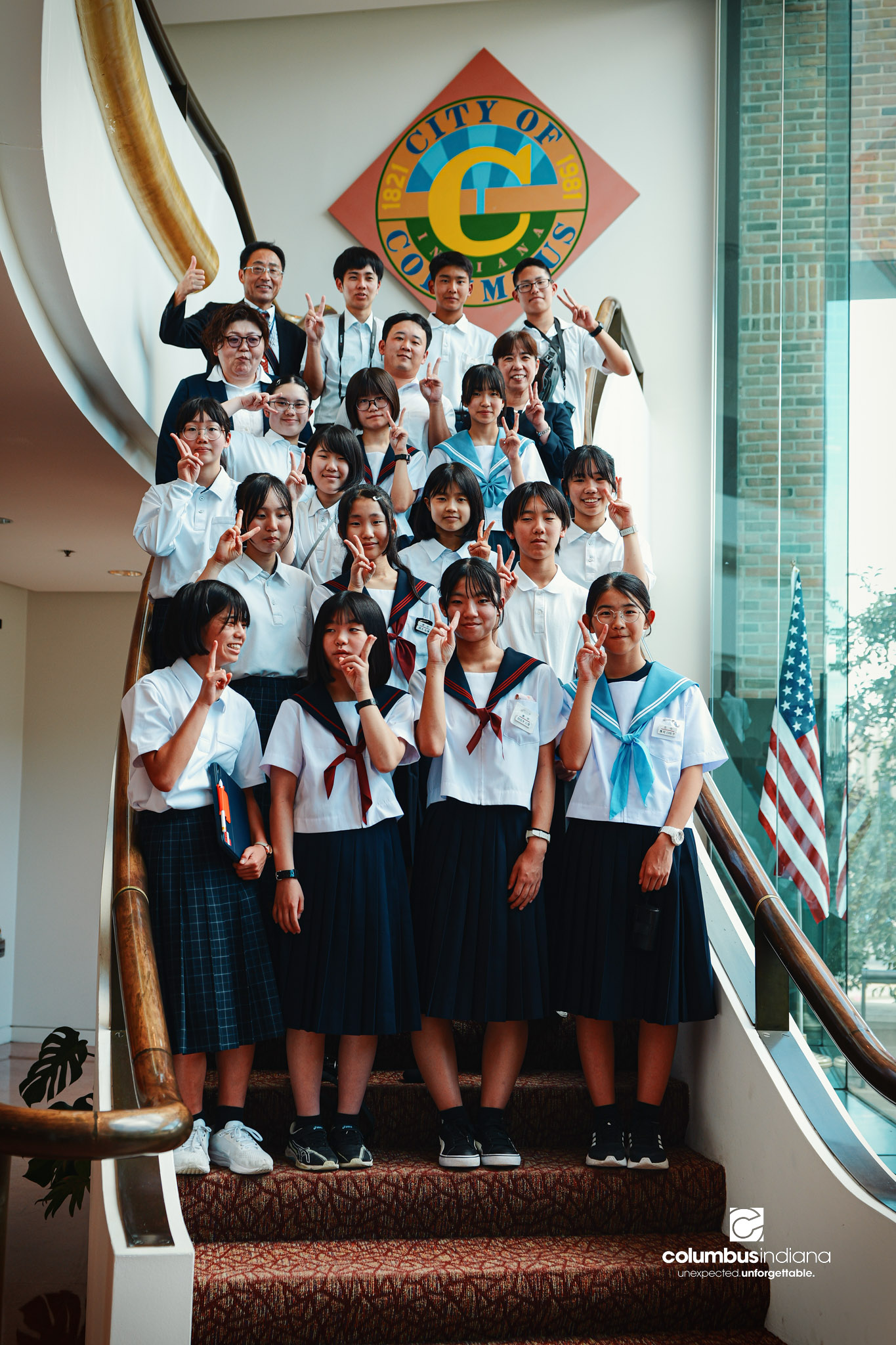 A delegation of students and school officials from Miyoshi-Minami Junior High School poses for a photo on a tour of Columbus City Hall in Columbus, Ind., Thursday, Aug. 20, 2026. Miyoshi is Columbus’ sister city in Japan. Student visits to Columbus