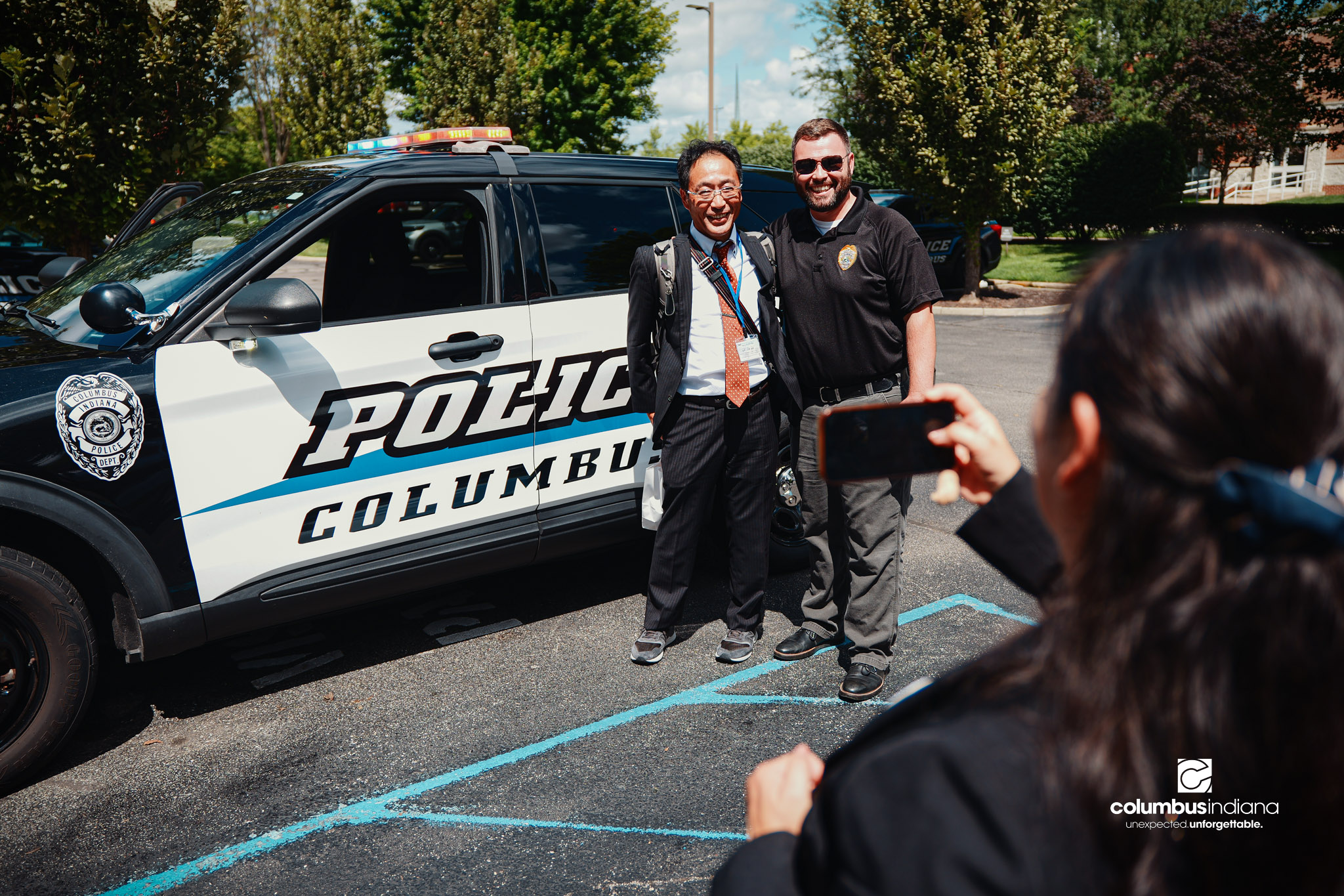Miyoshi-Minami Junior High School Principal Hioki Mutsuchika poses for a photo with Columbus Police Lt. Skylar Berry during a tour of the Columbus Police Department in Columbus, Ind., Thursday, Aug. 20, 2026. Miyoshi is Columbus’ sister city in Jap