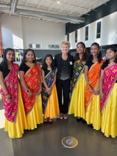 Columbus Mayor Mary Ferdon poses with dancers from Infinite Rhythms by Ruhana pose for a photo at the Asian Pacific American Public Affairs Indiana Chapter Annual Gala in Indianapolis.
