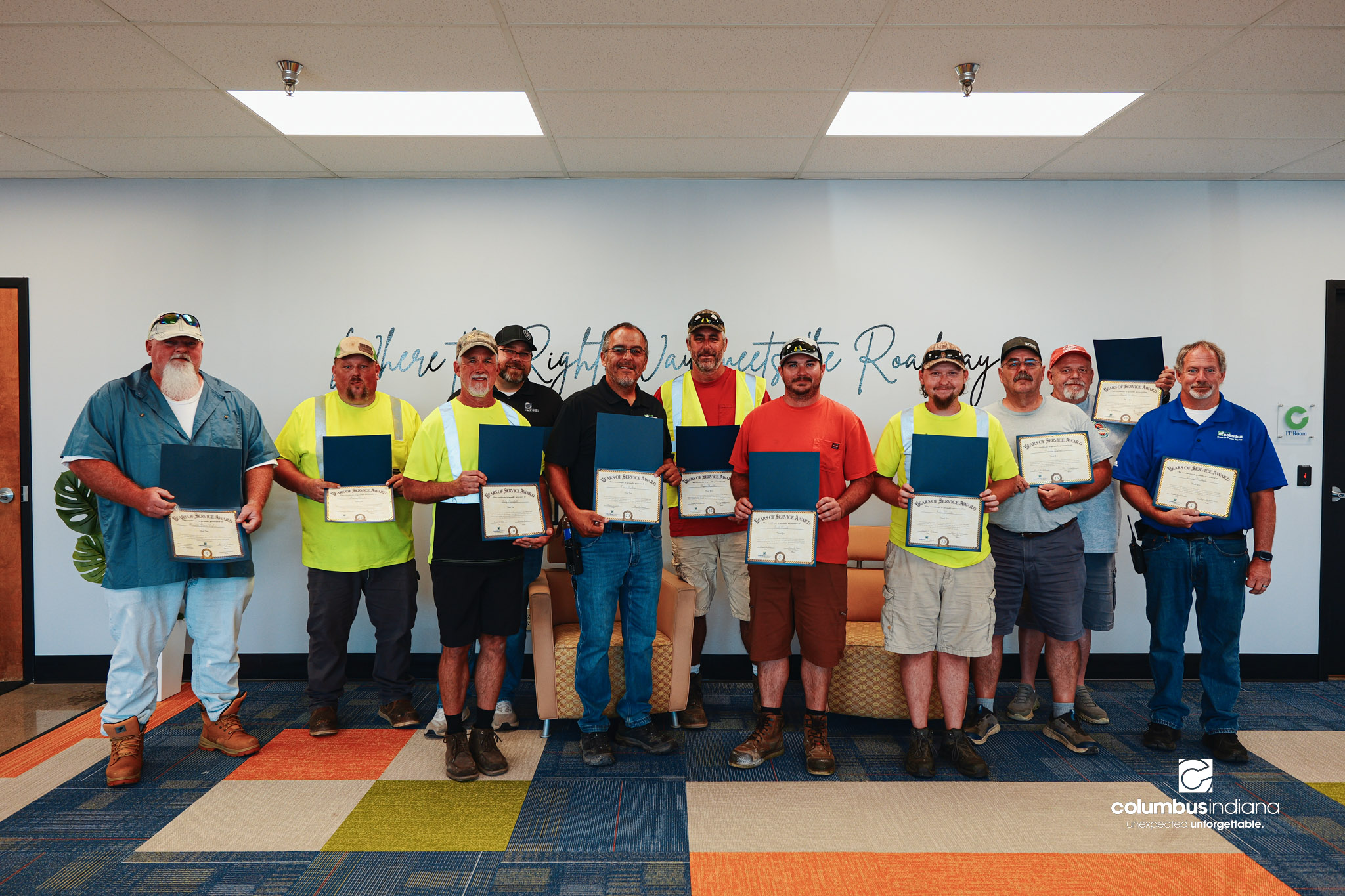 These images show an employee appreciation lunch and award ceremony for years of service to the Columbus, Indiana Department of Public Works.