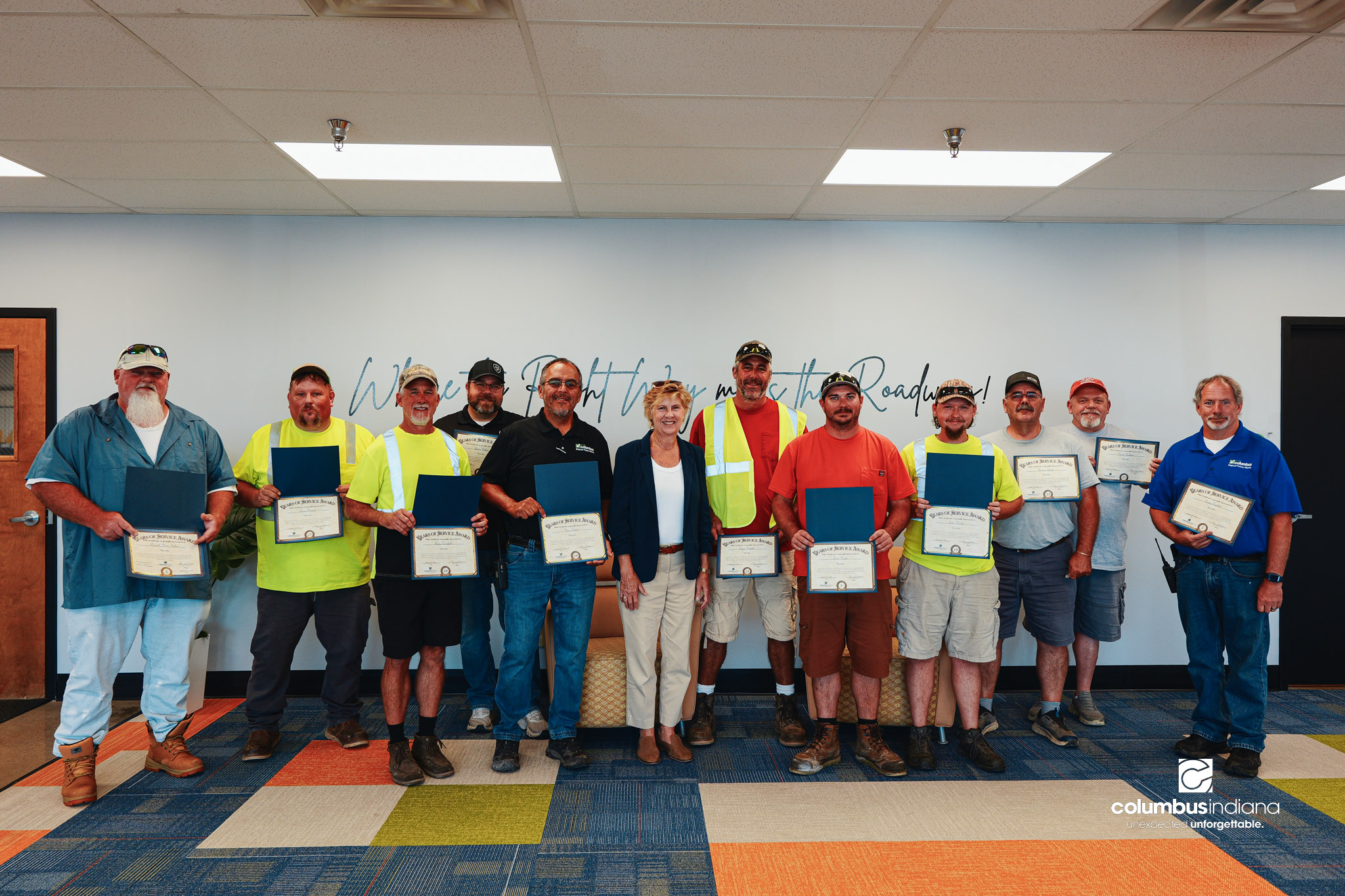 These images show an employee appreciation lunch and award ceremony for years of service to the Columbus, Indiana Department of Public Works.