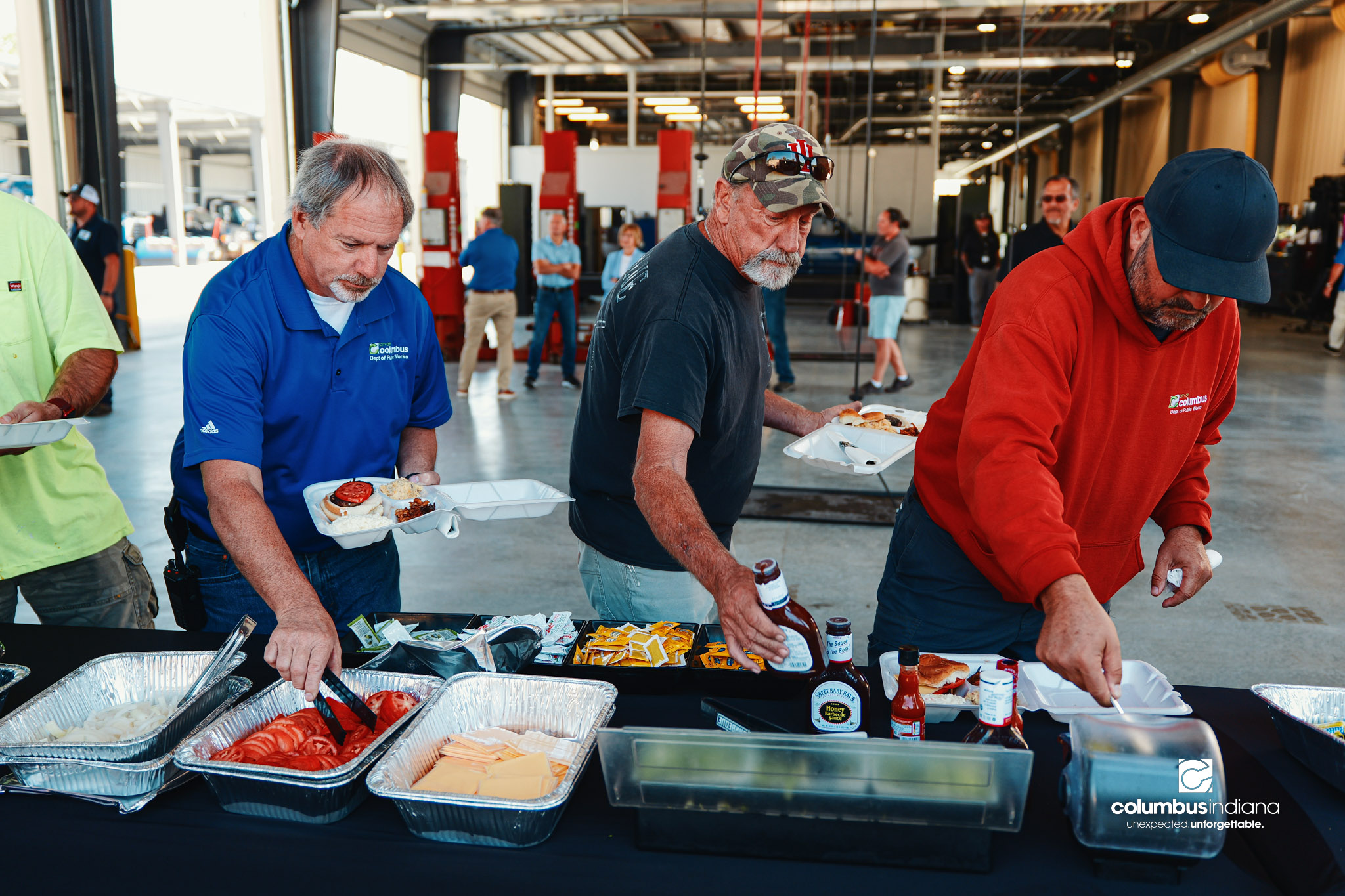 These images show an employee appreciation lunch and award ceremony for years of service to the Columbus, Indiana Department of Public Works.