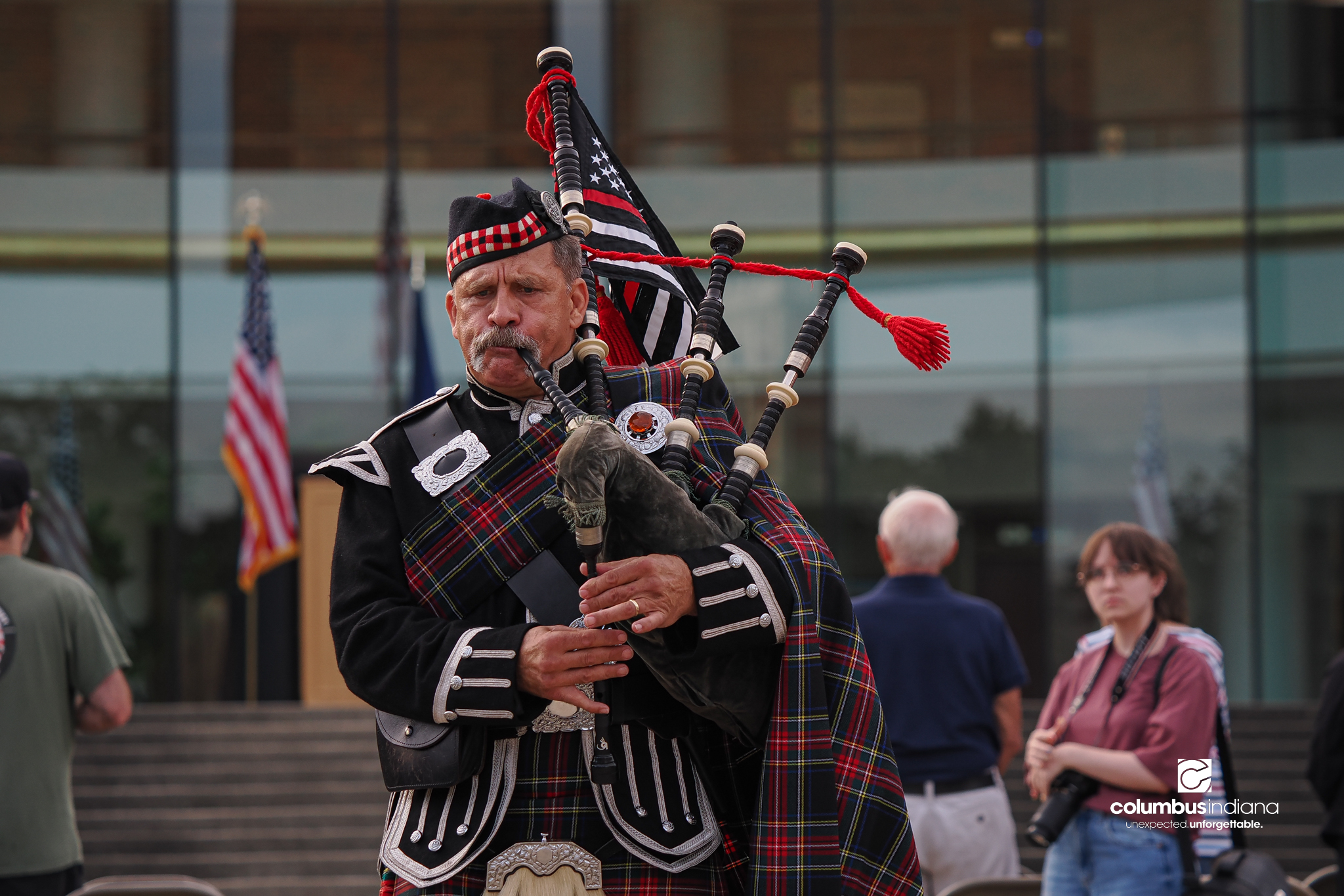Columbus Fire Department Deputy Chief of Administration Mike Kutsko plays the bagpipes during a ceremony to commemorate the 25th anniversary of Sept. 11, at Columbus City Hall in Columbus, Ind., Friday, Sept. 11, 2026.