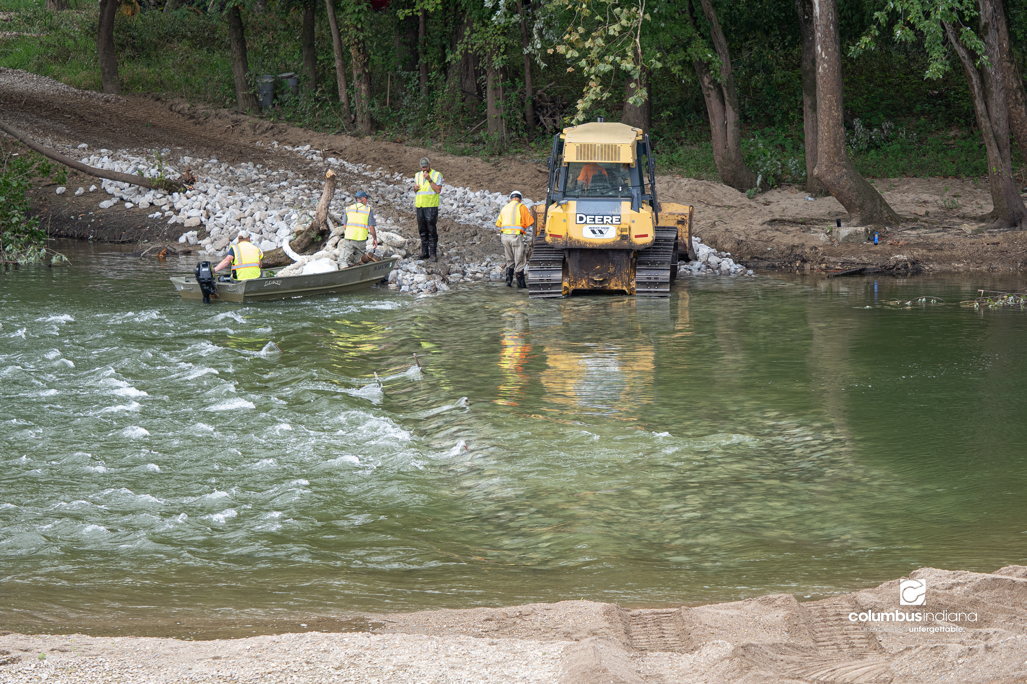 Workers being removing the low head damn as part of the Riverfront Project in Columbus, Ind., Friday, Sept. 18, 2026.
