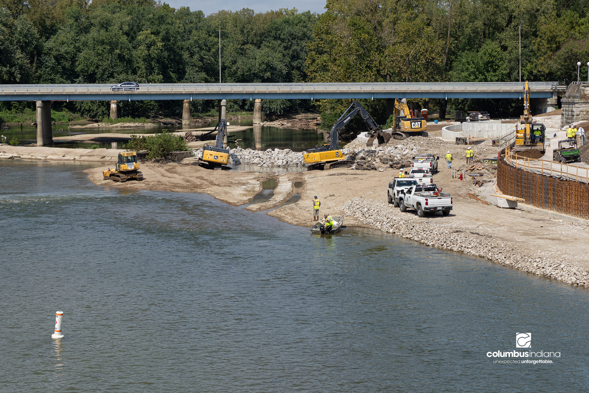 Workers being removing the low head damn as part of the Riverfront Project in Columbus, Ind., Friday, Sept. 18, 2026.