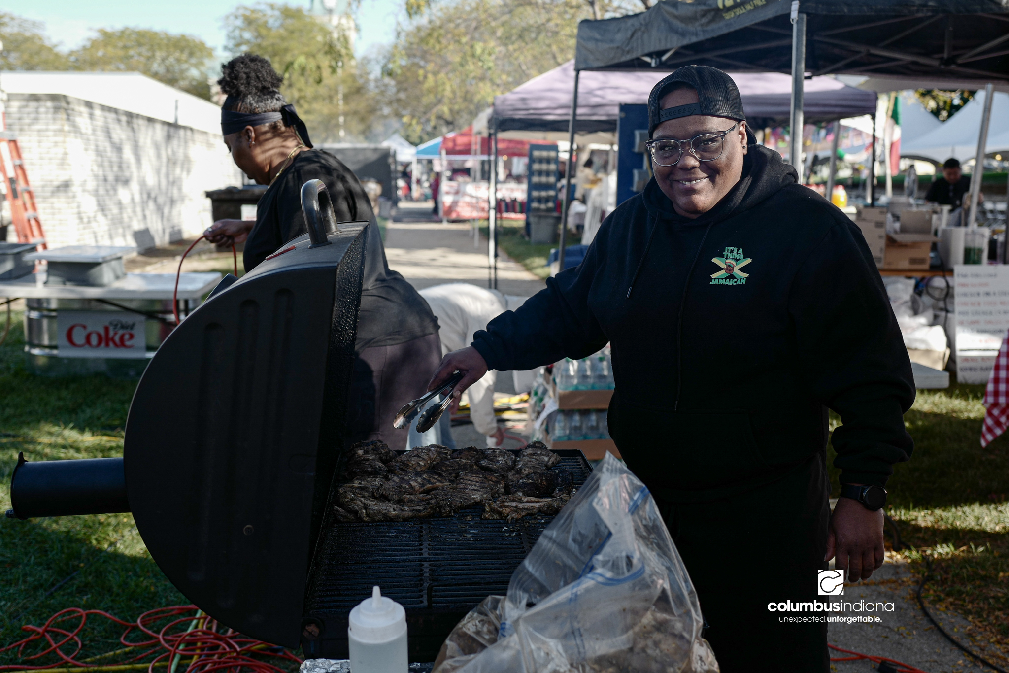 Various images of the sights of Ethnic Expo in Columbus, Indiana. The photos show food, people of different ethnicities and performances as well tents and other spaces vendors are using.