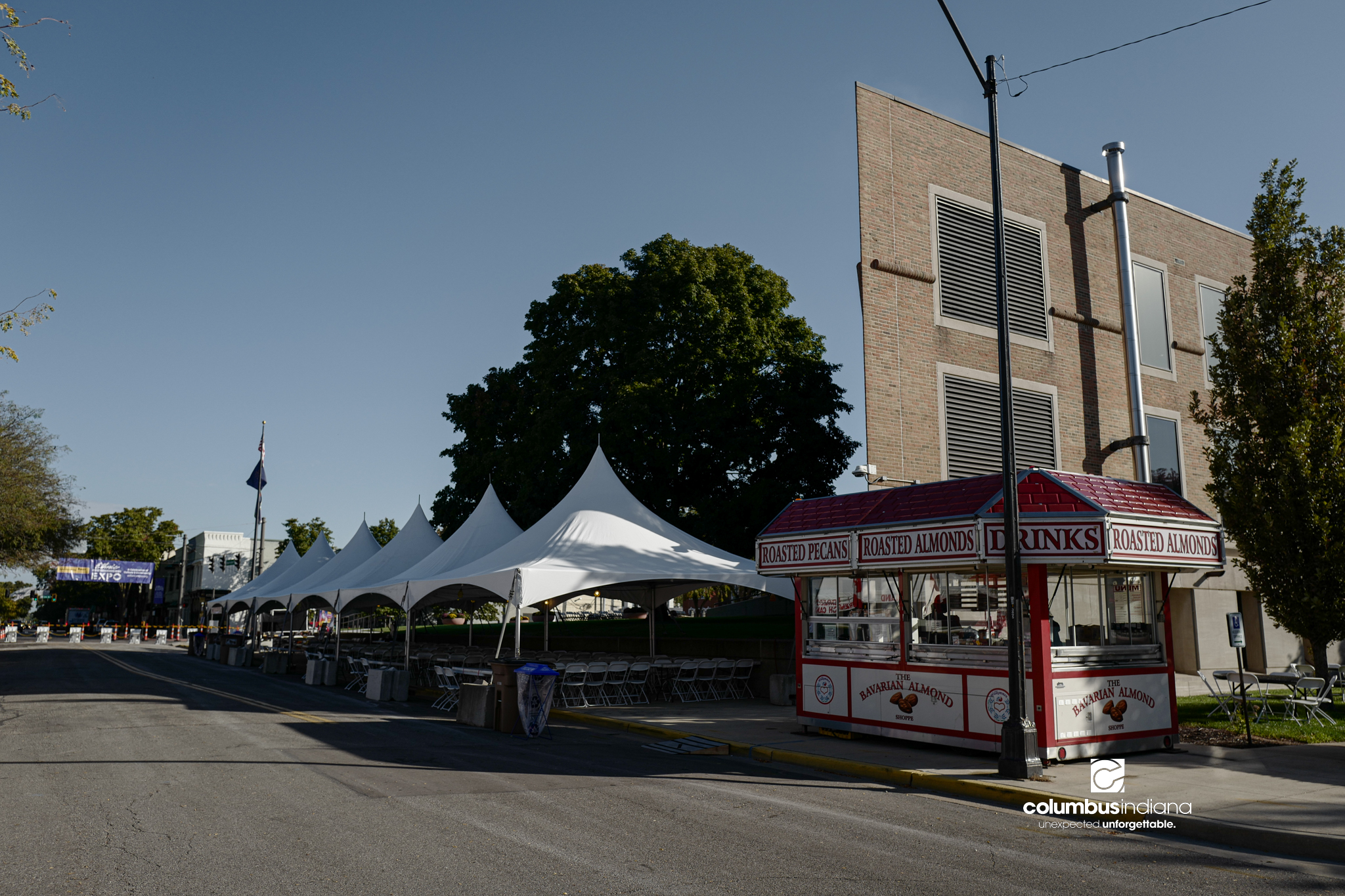 Various images of the sights of Ethnic Expo in Columbus, Indiana. The photos show food, people of different ethnicities and performances as well tents and other spaces vendors are using.