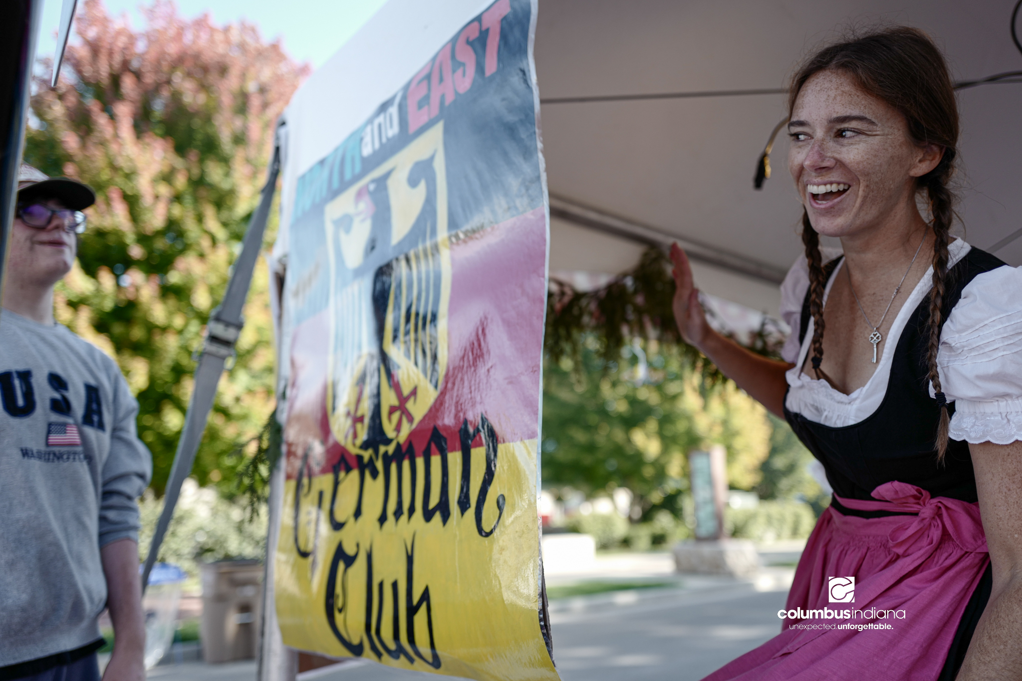 Various images of the sights of Ethnic Expo in Columbus, Indiana. The photos show food, people of different ethnicities and performances as well tents and other spaces vendors are using.
