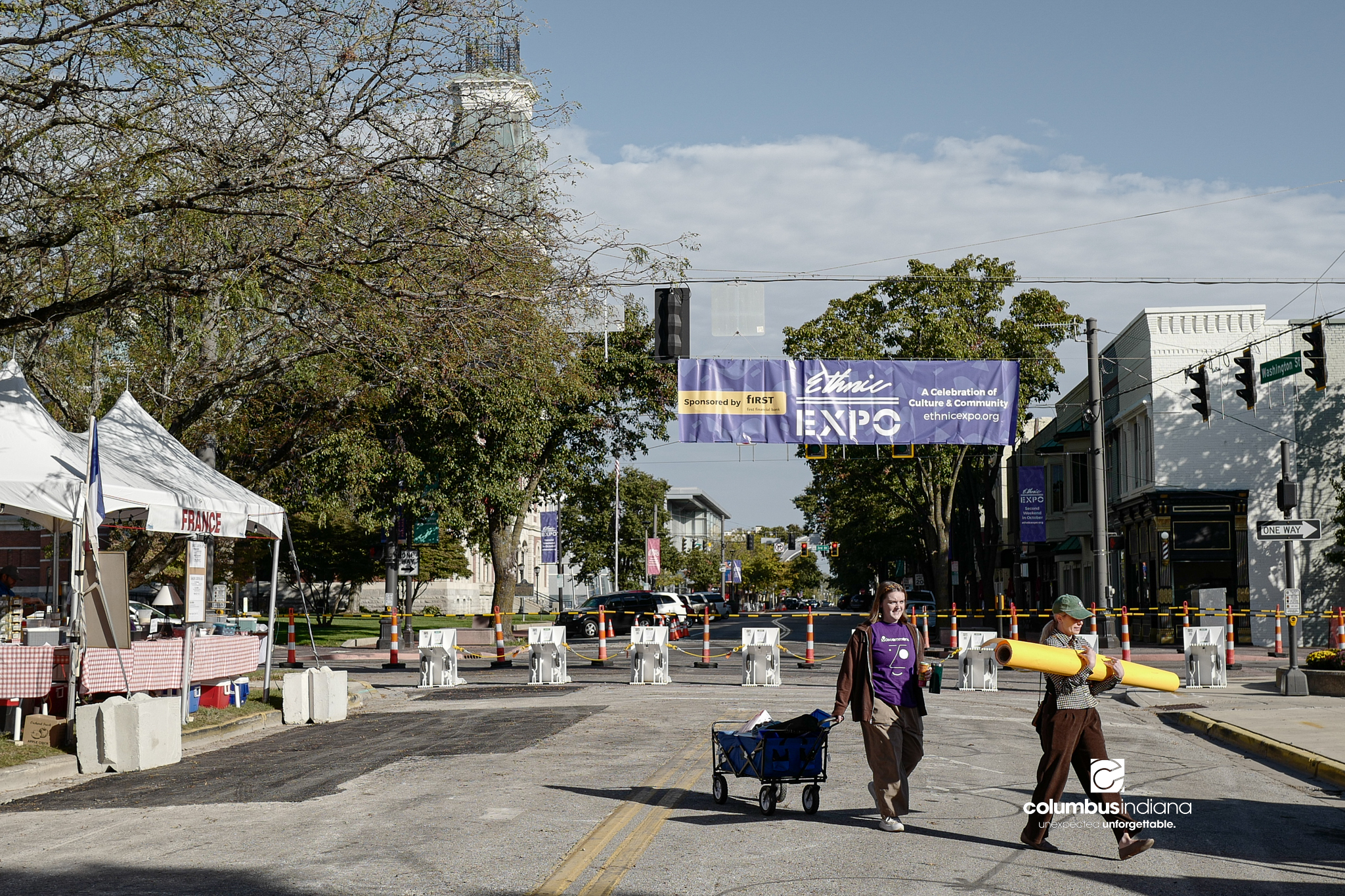 Various images of the sights of Ethnic Expo in Columbus, Indiana. The photos show food, people of different ethnicities and performances as well tents and other spaces vendors are using.