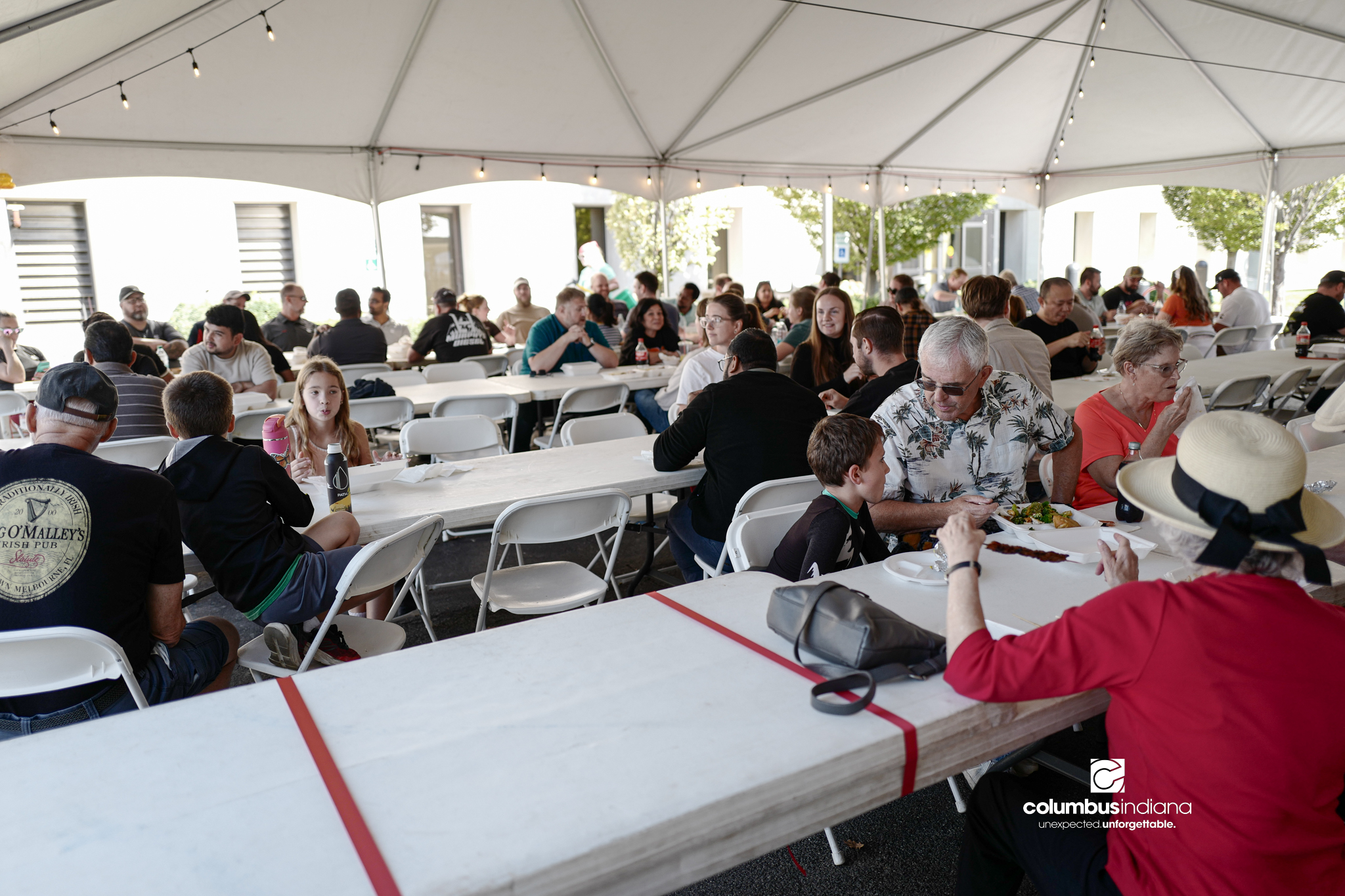 Various images of the sights of Ethnic Expo in Columbus, Indiana. The photos show food, people of different ethnicities and performances as well tents and other spaces vendors are using.