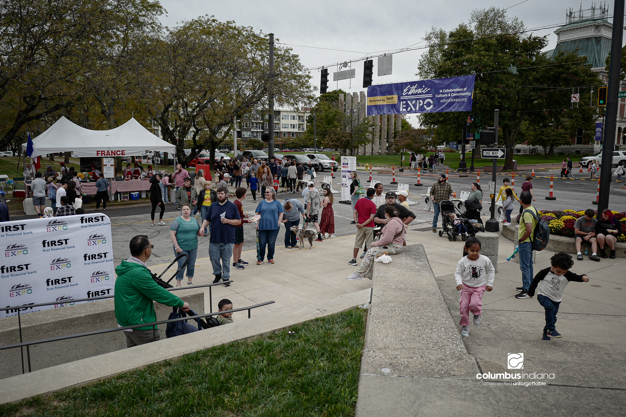 A scene setting photo of people gathered for a street festival.